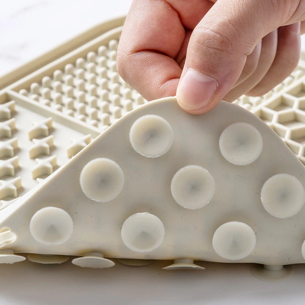 Underside of a lick mat showing the strong suction cups | Pawnests